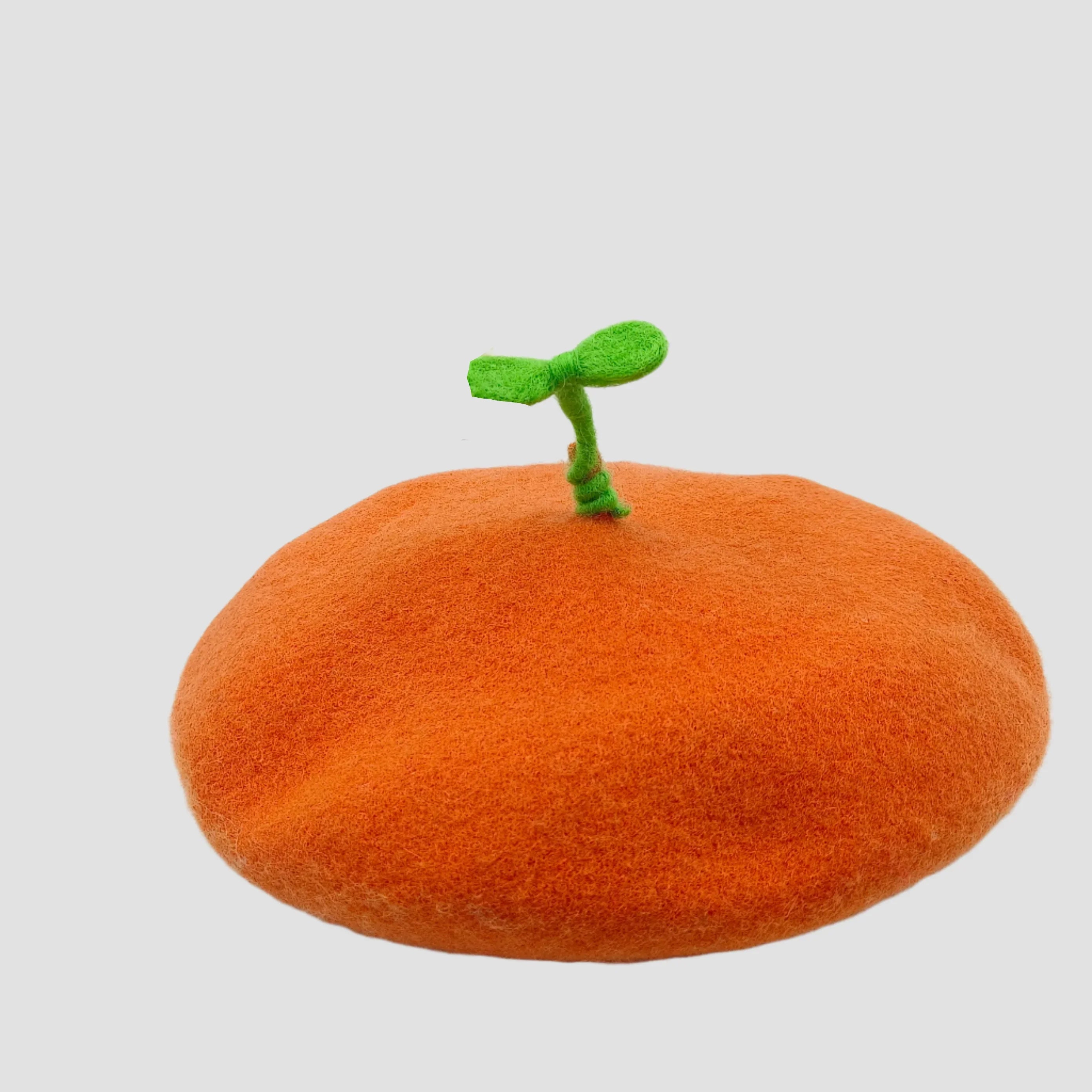 Orange beret with green stem.