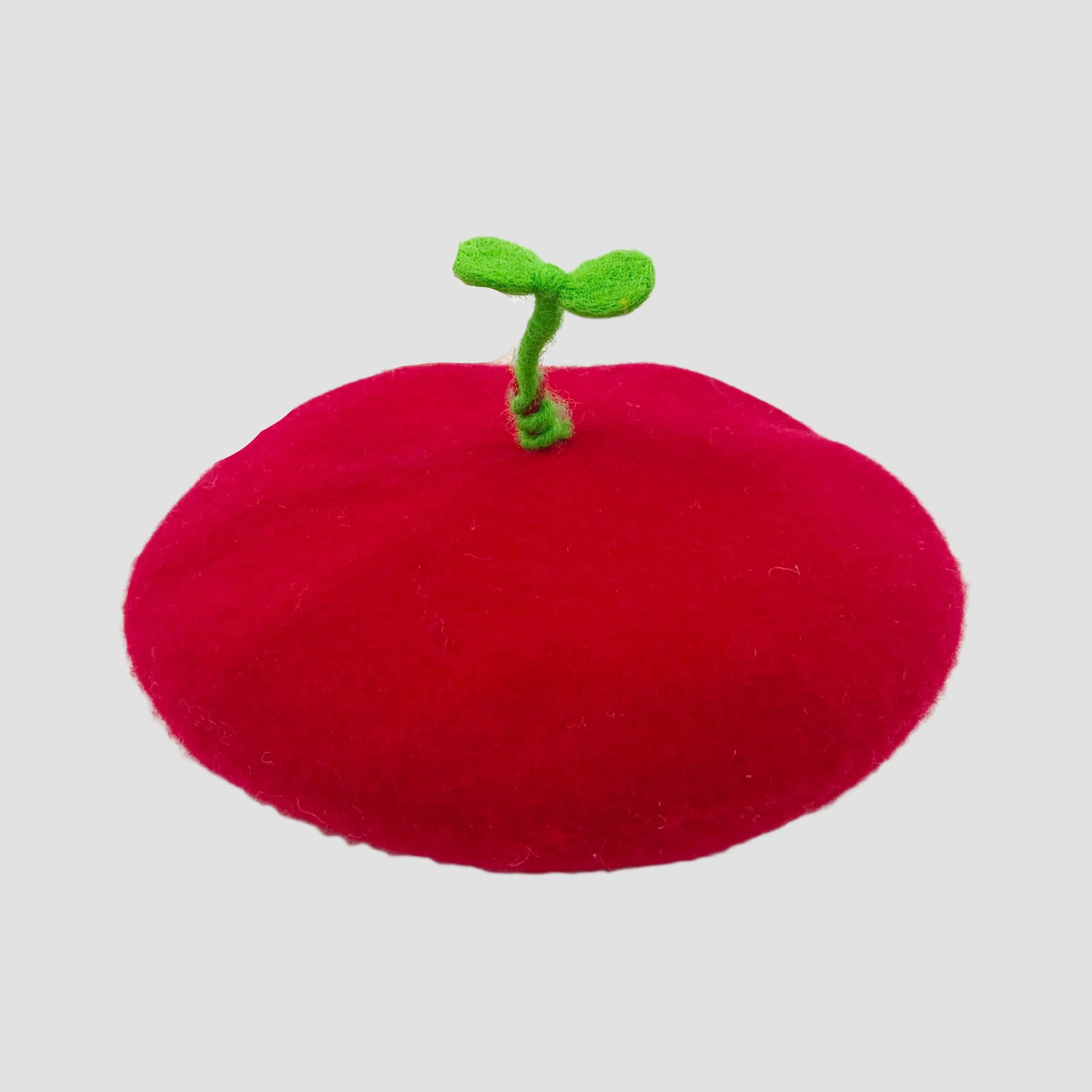 Red, plush, beret-style hat with green sprout.