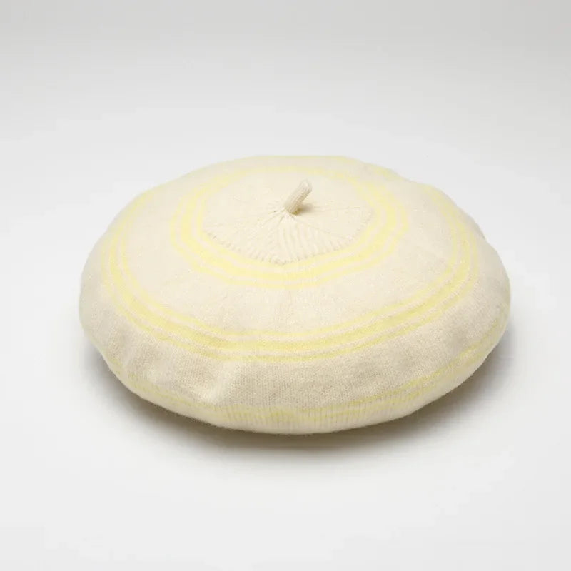 Cream-colored beret with yellow stripes.
