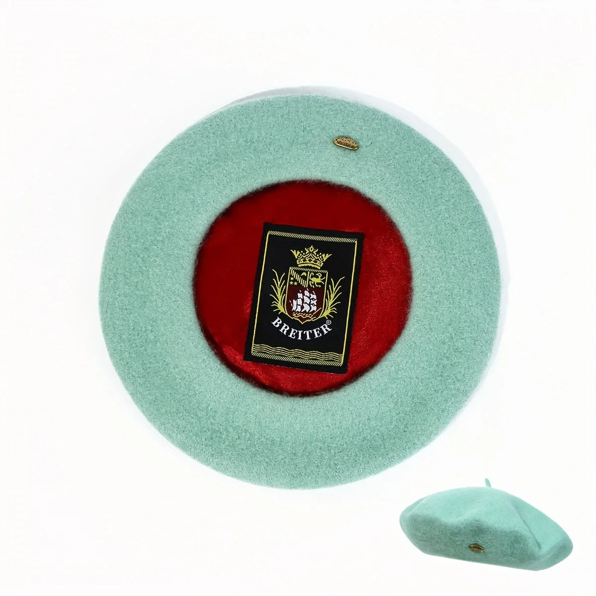 Mint green Lined Beret, top view with red satin lining.