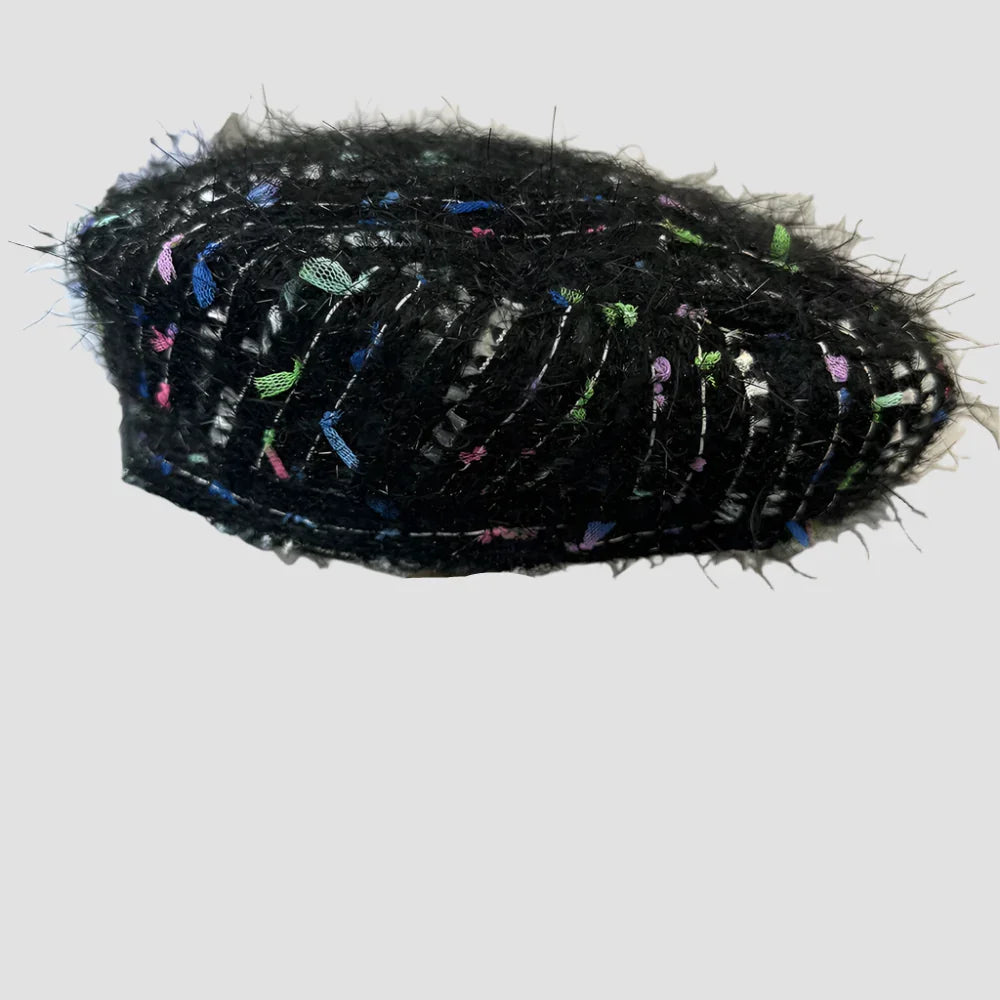 Black tweed beret with colorful accents.