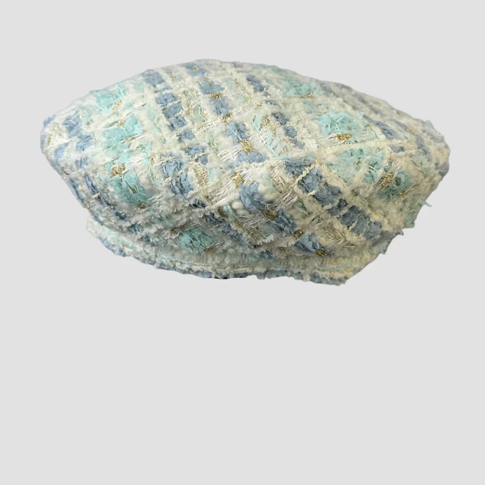 Tweed beret with blue and green accents.