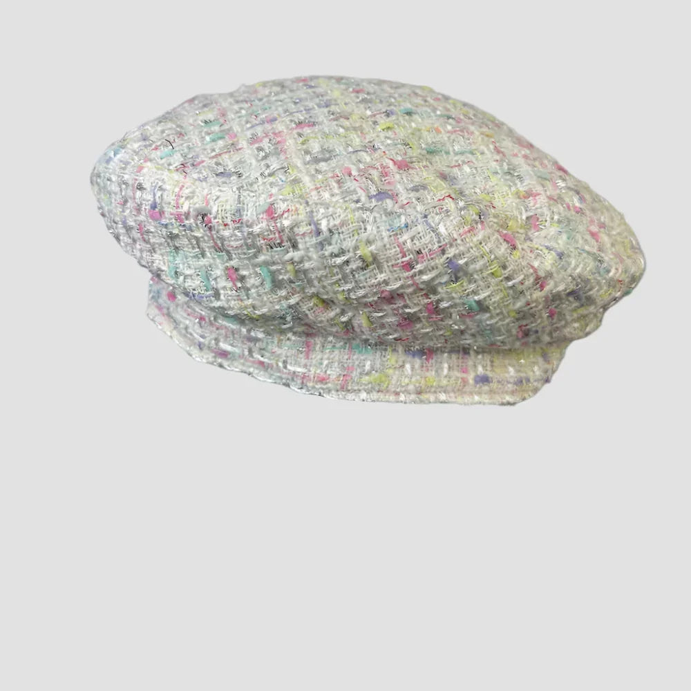 Tweed beret with colorful flecks.
