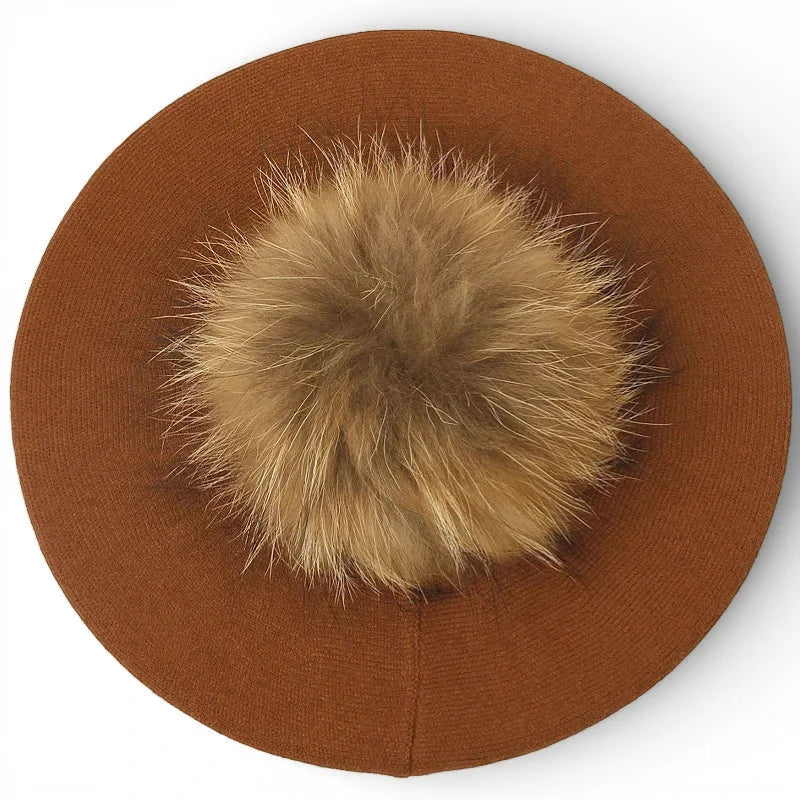 Brown knit French beret with fluffy light tan fox fur pom-pom