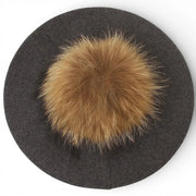 Dark gray wool French beret with fluffy tan fox fur pom-pom