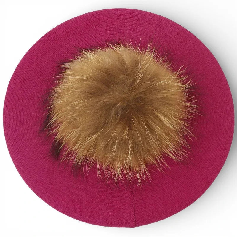 Fuchsia knit French beret with fluffy tan fox fur pom-pom