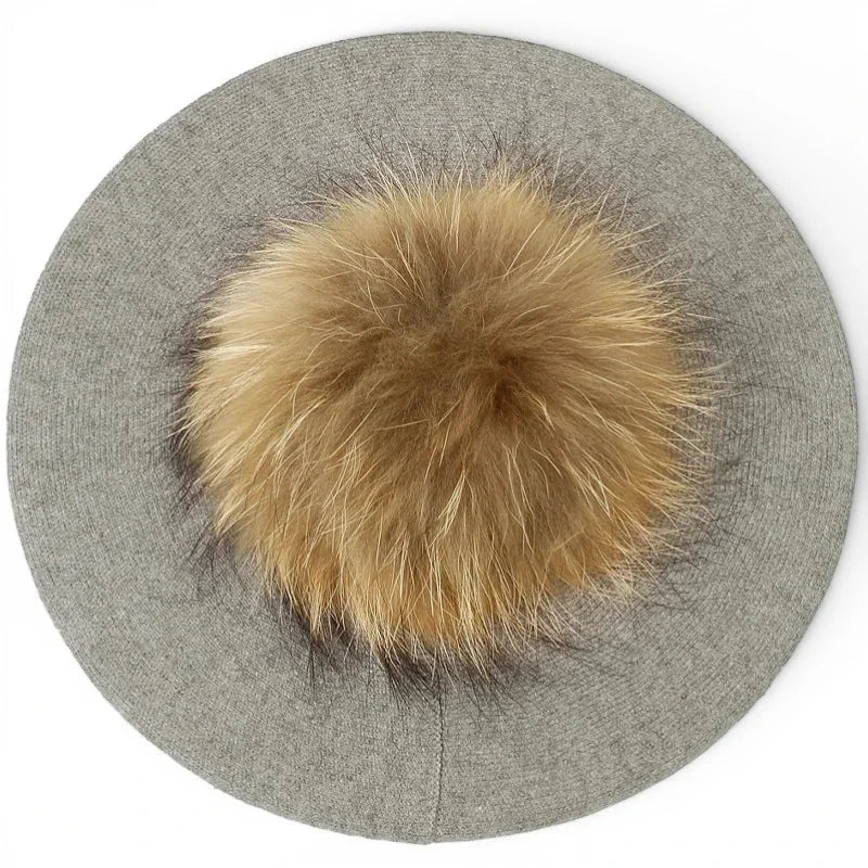 Gray wool French beret with fluffy tan fox fur pom-pom