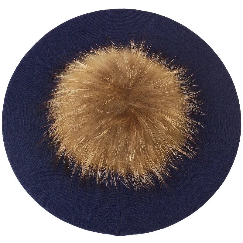 Navy blue beret with fur pompom.