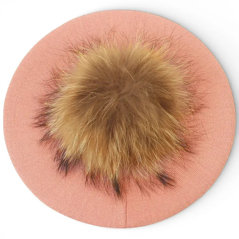 French beret with soft peach knit and fluffy golden-brown fox fur pom-pom