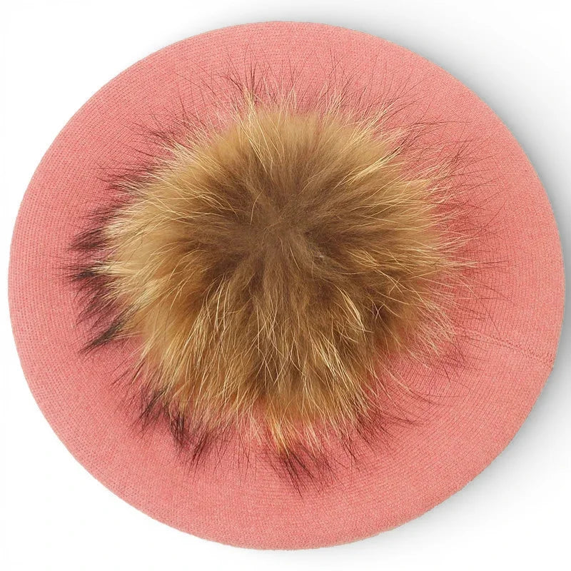 Soft pink French beret with fluffy golden-brown fur pom-pom