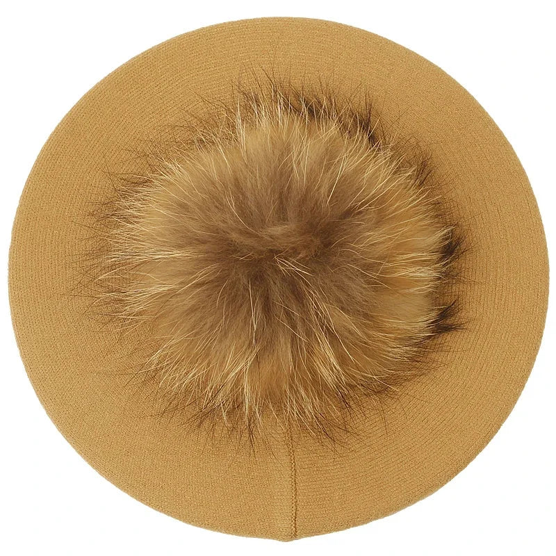 Tan beret with fur pompom.