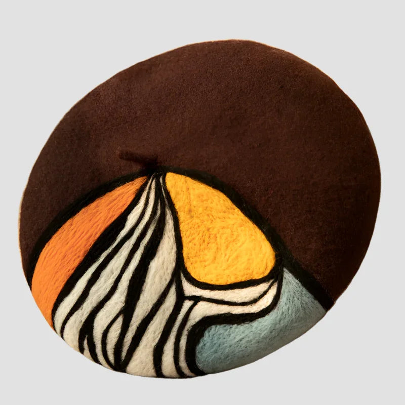 Brown beret with colorful design.