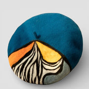 French Painter Beret plush cushion with stylized black white striped mountain on blue