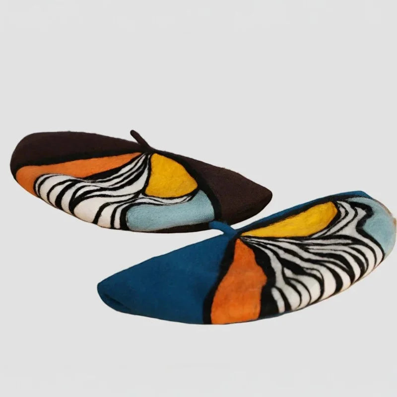 Two French Painter Berets with bold abstract patterns in black, white, orange, yellow, teal