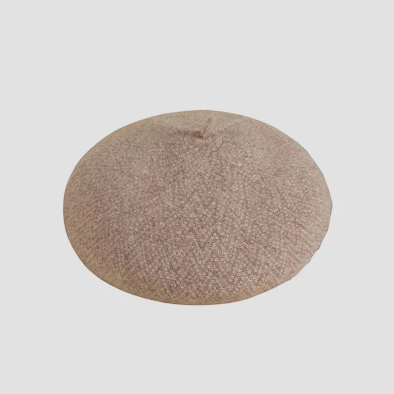 Soft beige French wool beret with textured woven fabric surface