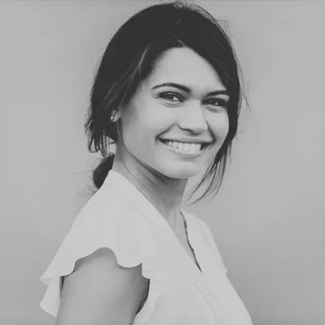 Black and white portrait of a woman with a plain background