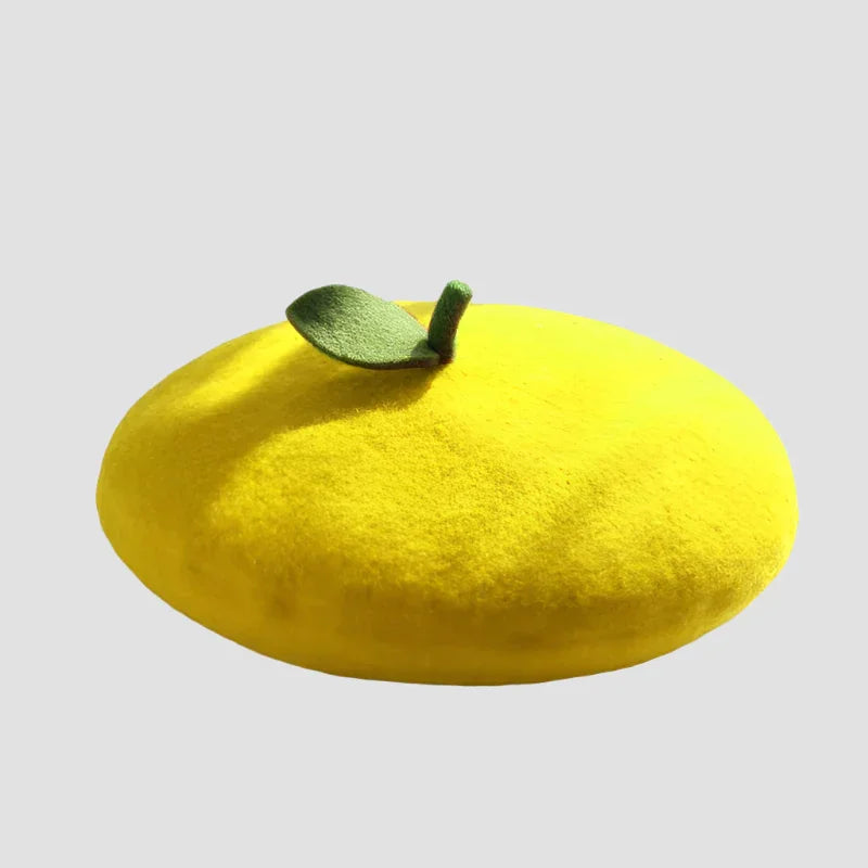 Yellow beret with green leaf.