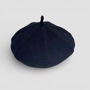 Genuine French Beret: sleek black woven fabric with rounded top