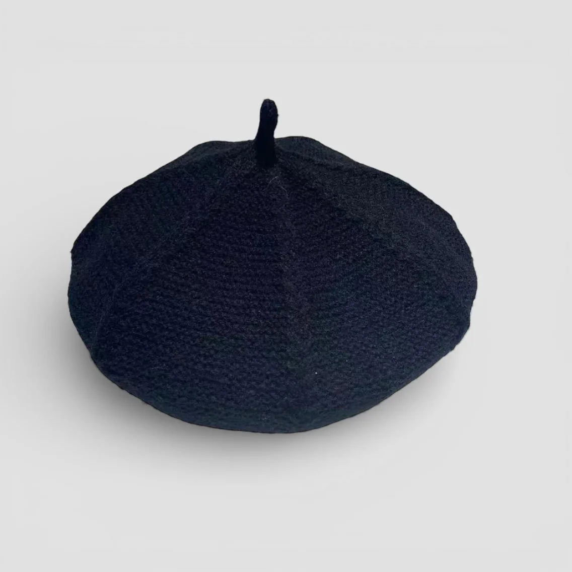 Genuine French Beret: sleek black woven fabric with rounded top