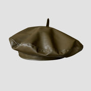 Olive green leather beret.