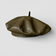 Olive green faux leather beret with rounded crown and button