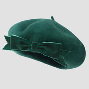 Emerald green beret with bow.