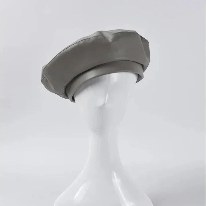 Sleek matte gray leather beret with structured padded crown and rounded brim