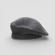 Soft dark gray wool beret with fuzzy knitted texture and rounded crown