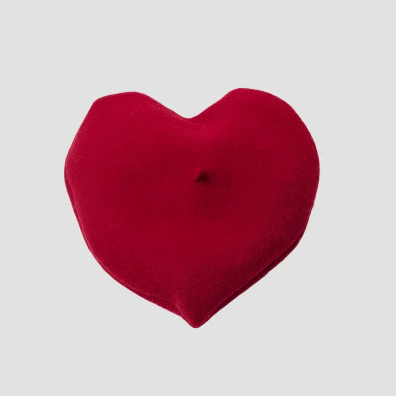 Red heart-shaped pillow.