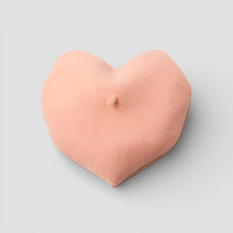 Heart shaped beret in soft peach-colored plush velvety cushion texture