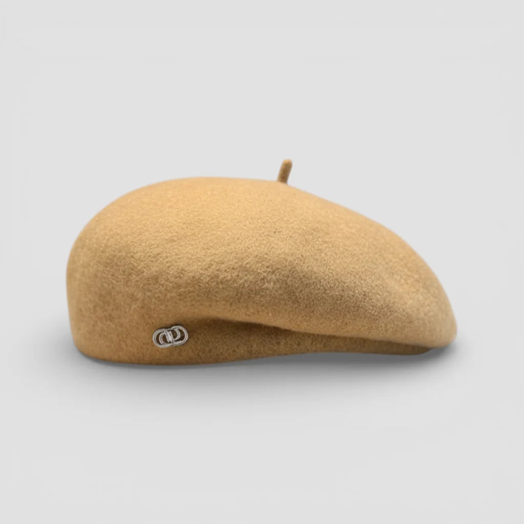 Tan knit beret cap with silver side logo and matching top button