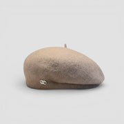 Taupe knit beret cap with metallic side logo and fabric top button