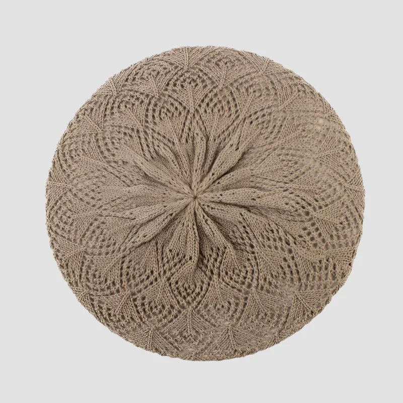 Beige knitted beret.