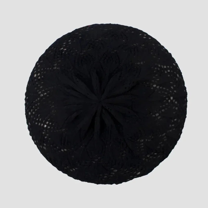 Black crocheted beret with textured openwork pattern and gathered center