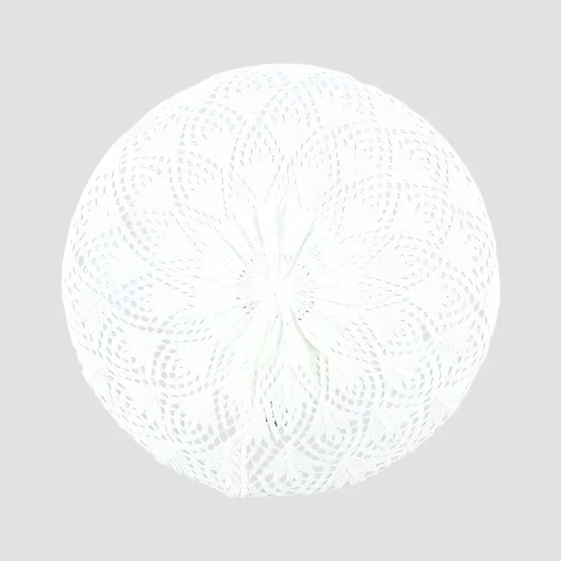 White crocheted round pillow.