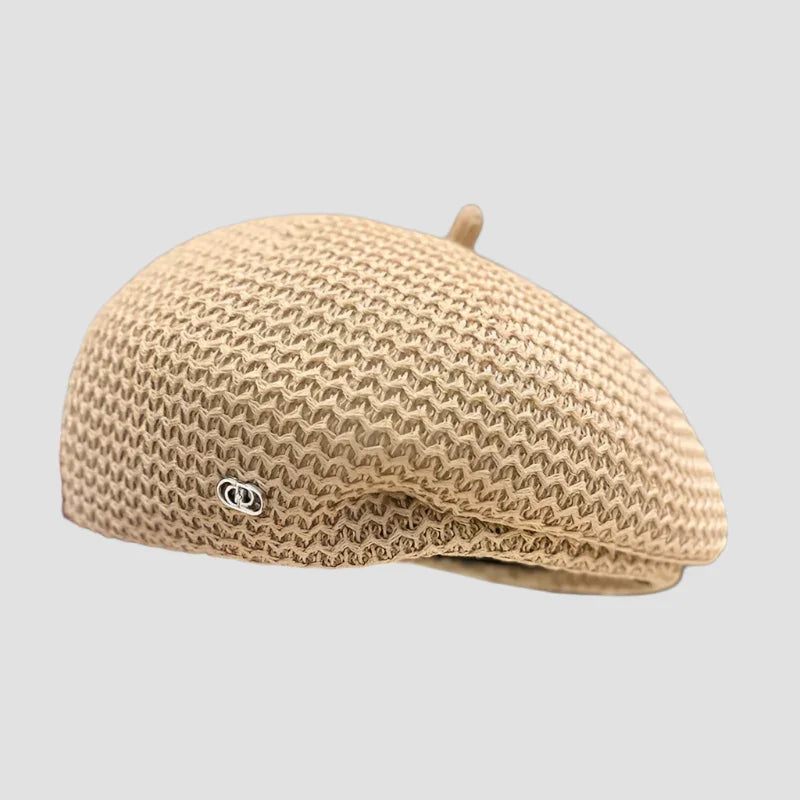 Beige knitted beret.