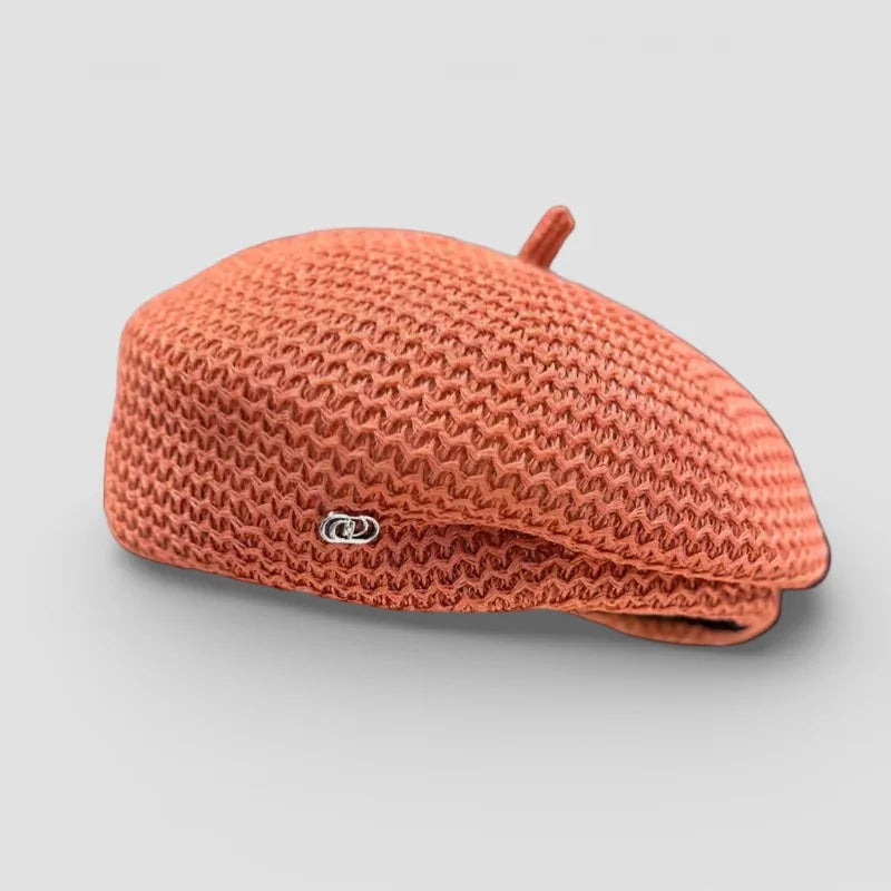 Knit beret women: coral-colored knitted beret with metallic side emblem