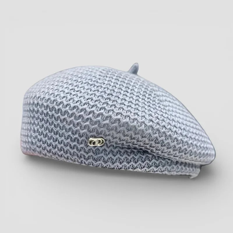 Light gray woven Knit Beret Women with textured pattern and metallic emblem