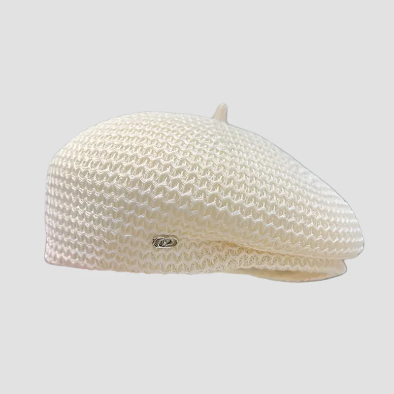 White knitted beret.