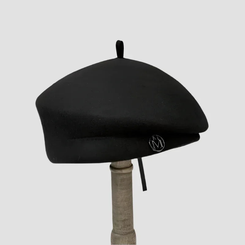 Black beret with emblem.