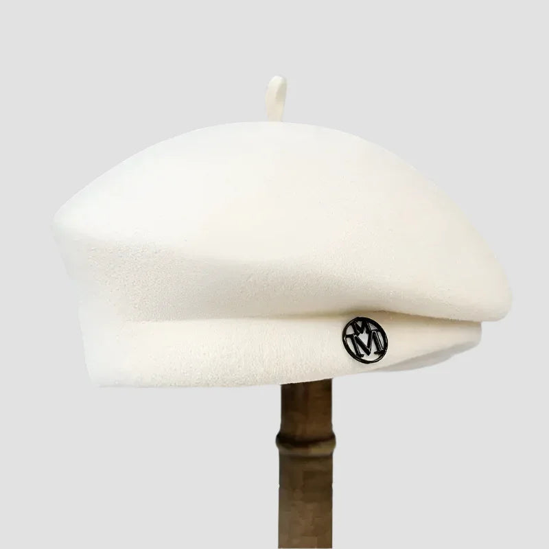 Cream-colored wool beret.