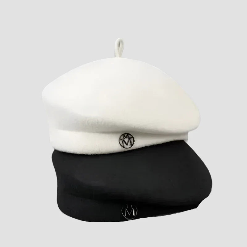 Stacked white and black berets.