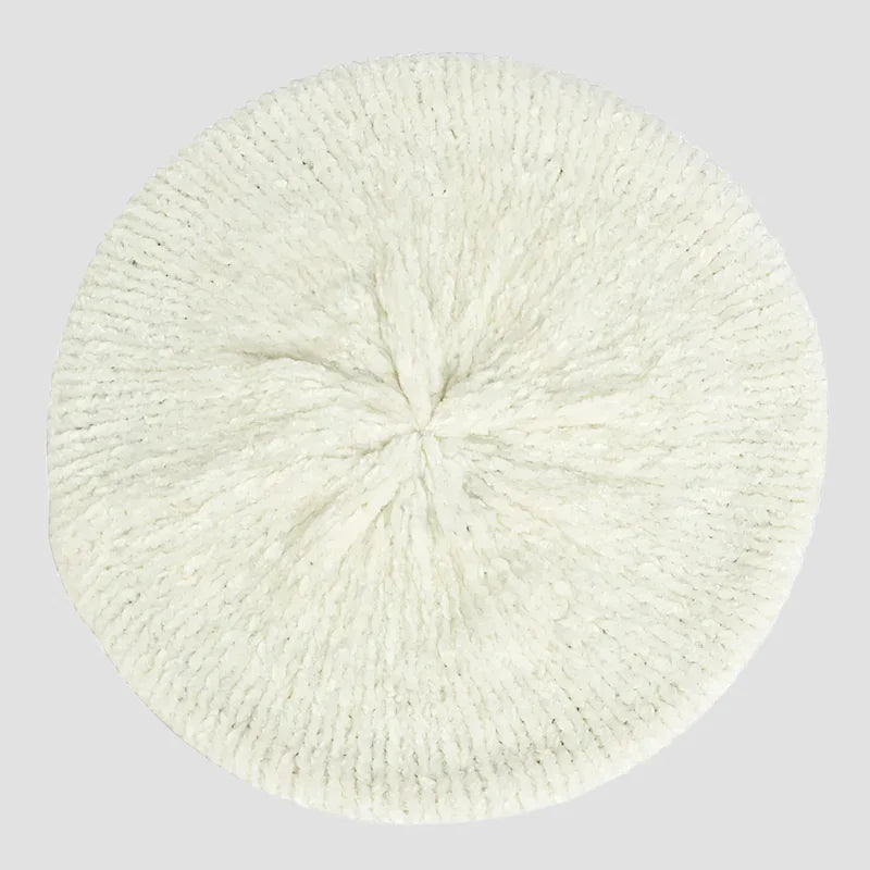 Cream-colored knitted beret.
