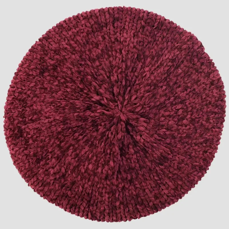 Rich burgundy knitted beret hat with plush circular textured rug design