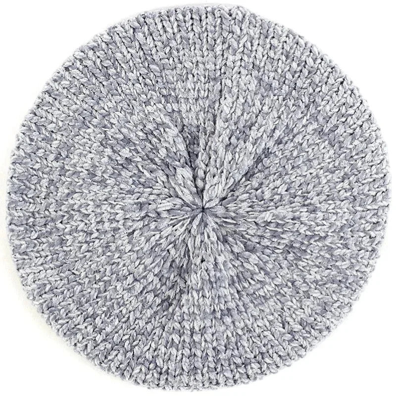 Soft light gray knitted beret hat with textured circular pattern