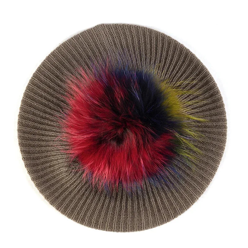 Knitted beret with colorful pompom.