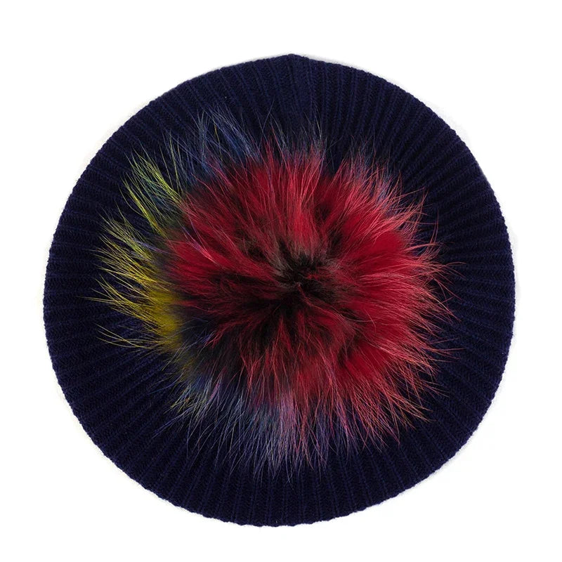 Navy blue knit hat with colorful pompom.