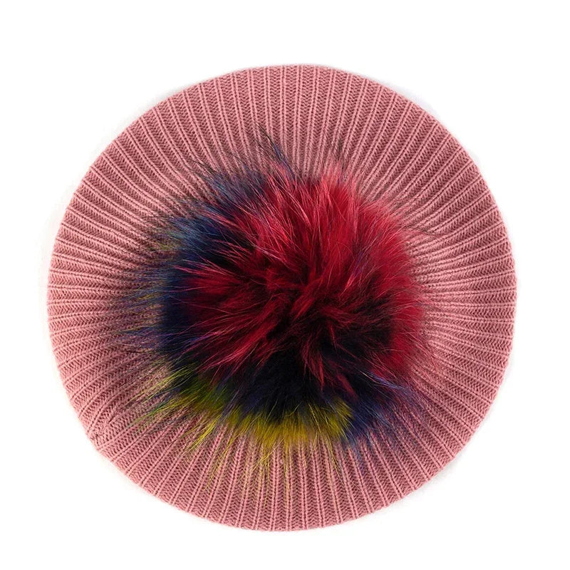 Pink knitted beret with colorful pompom.