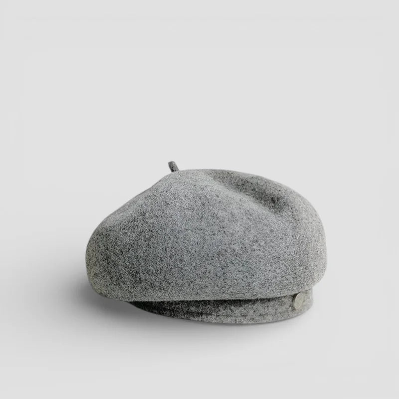 Ladies wool beret in soft heathered gray with subtle texture and side button