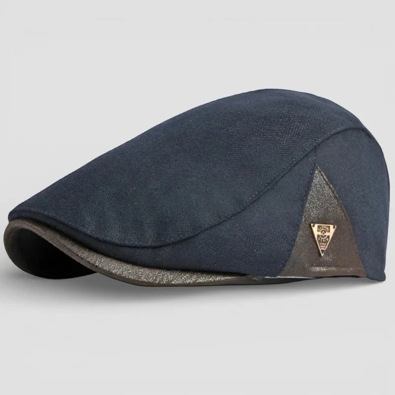 Dark blue leather beret cap with textured body and brown trim